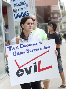 Supporters picket in Madison, Wis., to show their solidarity with striking Verizon workers