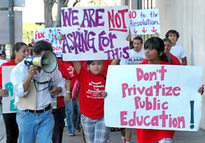 Teachers, students and community members in Los Angeles protest a decision to put 250 schools up for bidding